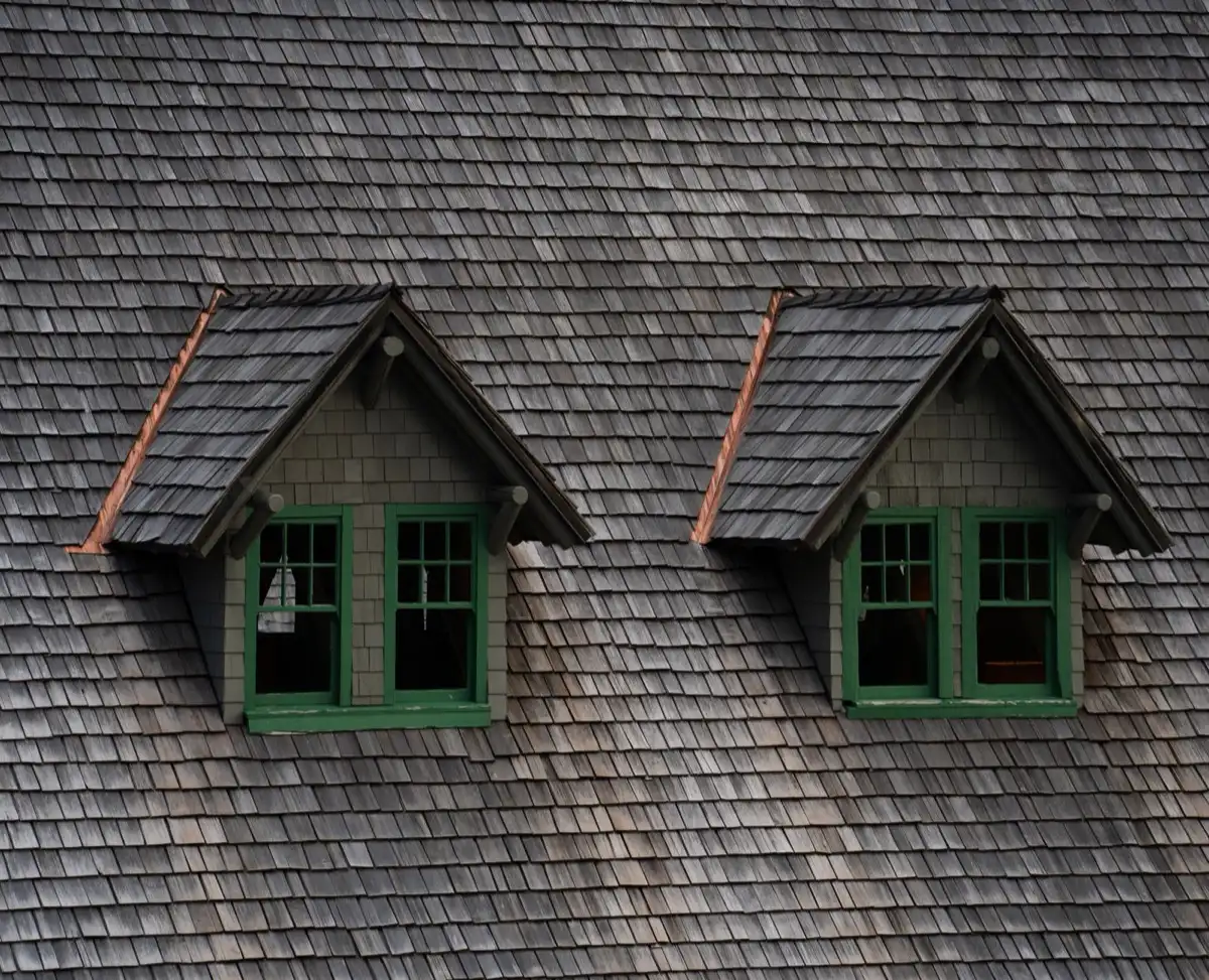 Dormers on a shingle roof in Farmington, NM, where step flashing and kickout flashing carry water past the walls